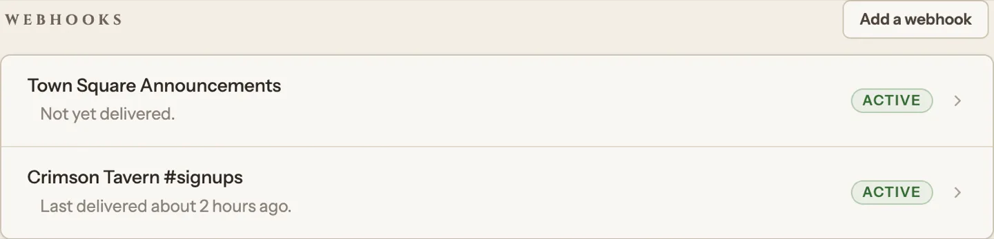 Each saved webhook shows its label, when it last delivered, and an Active pill.